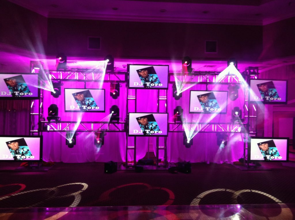 multiple video displays showing DJ Toro promos